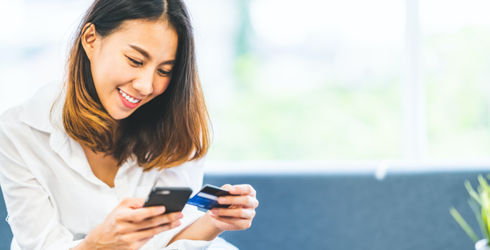 woman smiling at phone